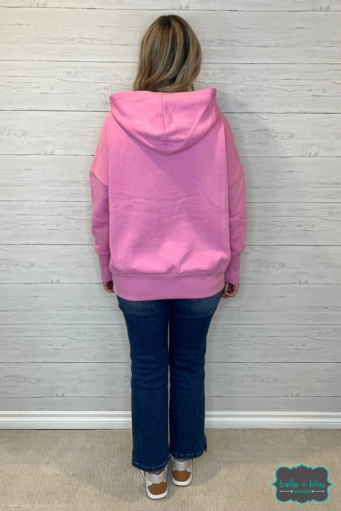 Pink snap sale on hoodie